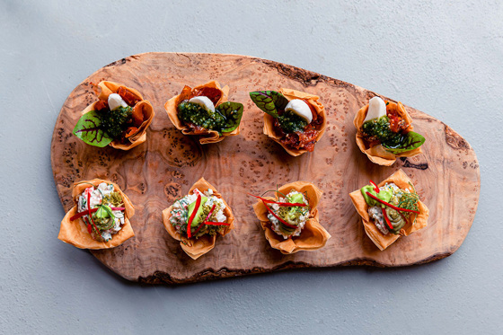 Wooden platter showcasing hors d'oeuvres